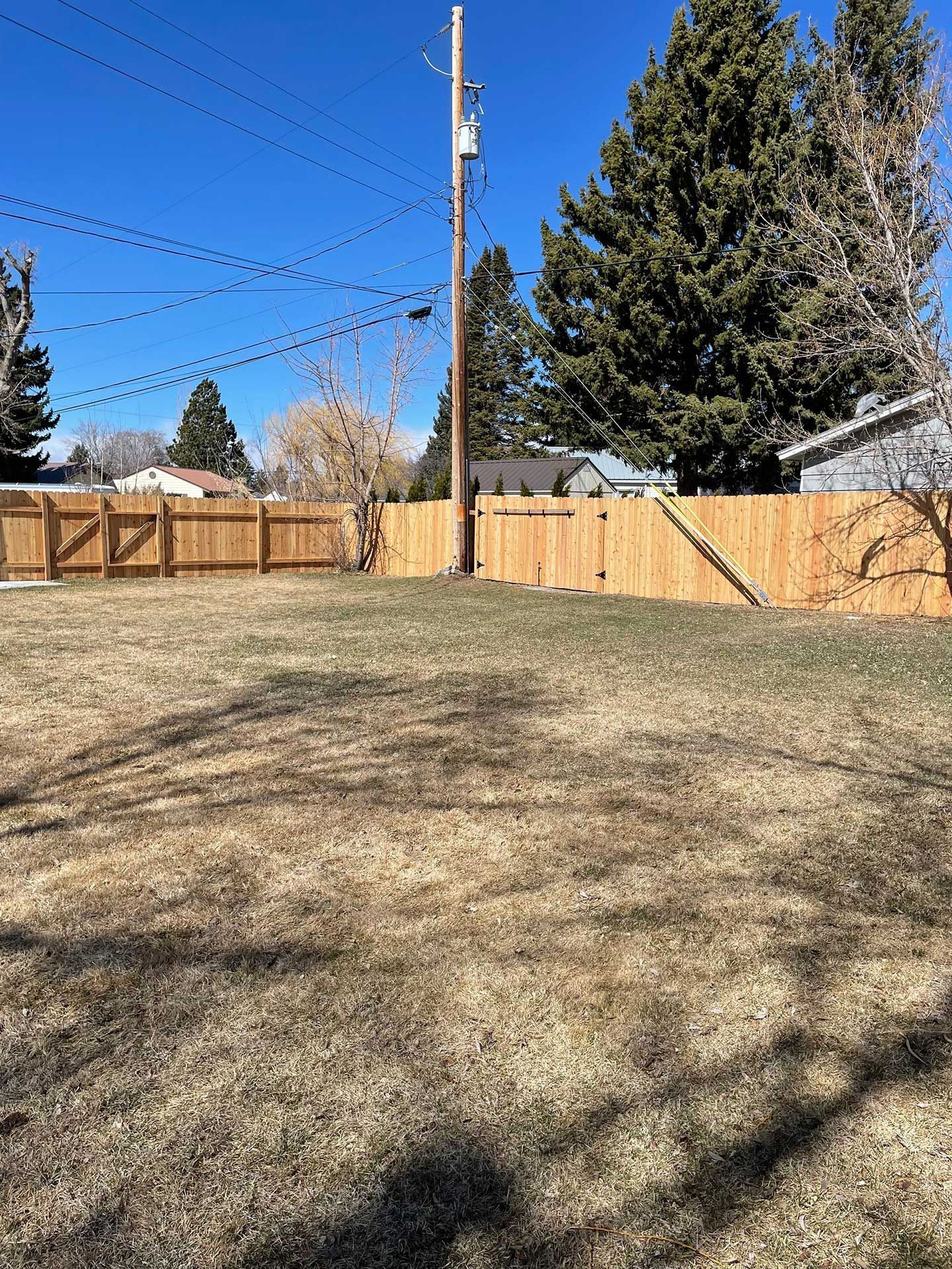 backyard with a wooden fence