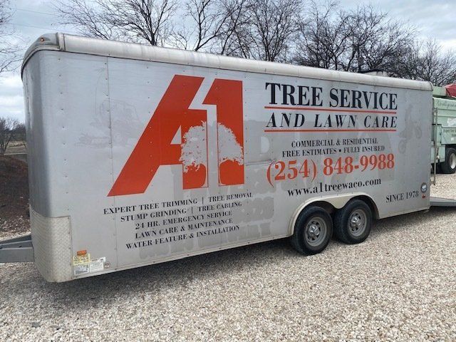Enclosed trailer with A1 Tree Service LLC's contact info
