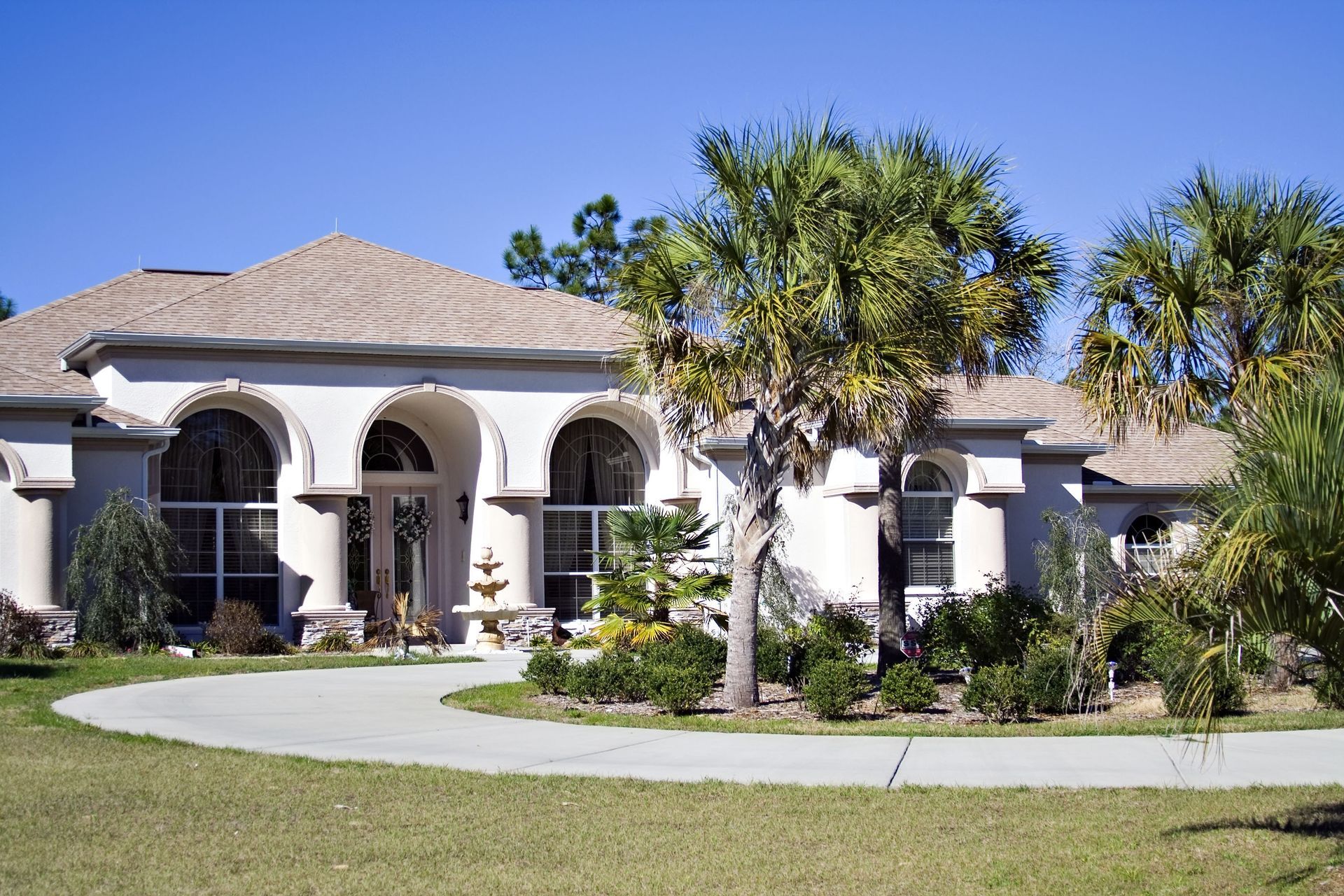 A brick house with a large bay window