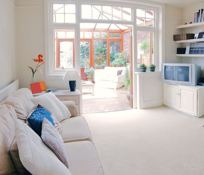 A living room with a couch and a television