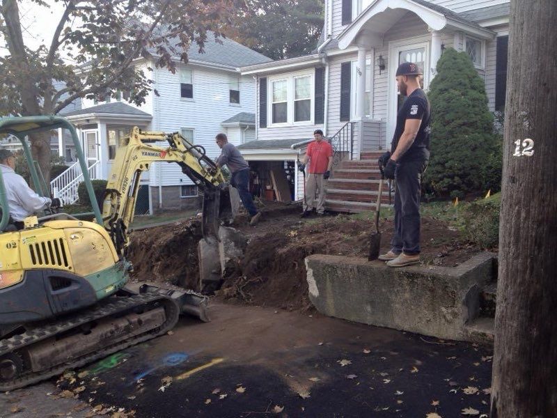 The number 12 is on a pole in front of a house