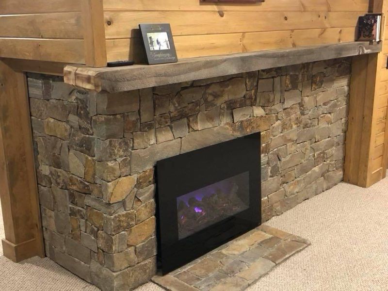 There is a fireplace in the middle of the room.