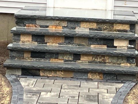 A set of stone steps leading up to a house