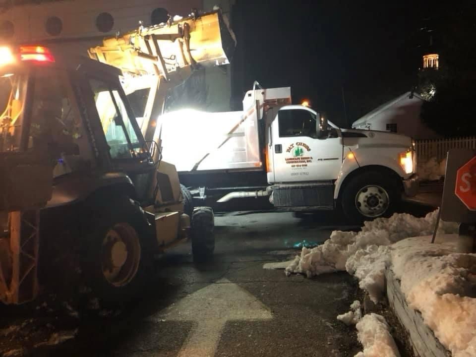 A truck with a stop sign in front of it