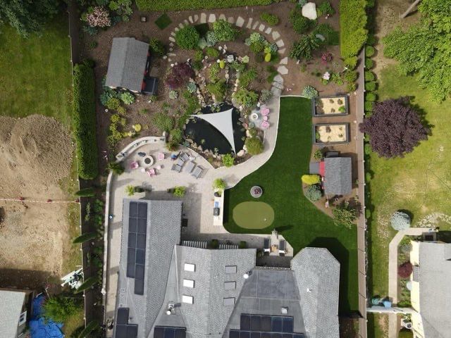 An aerial view of a house with a large yard