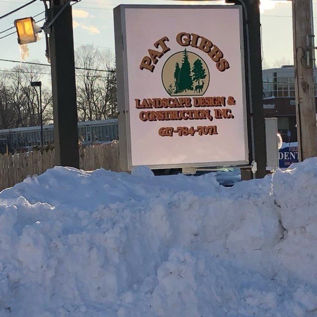 A sign for pat gibbs landscape design and construction