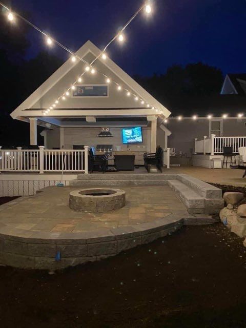 A house with a fire pit in front of it