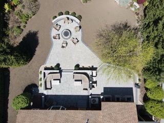 An aerial view of a patio with a table and chairs