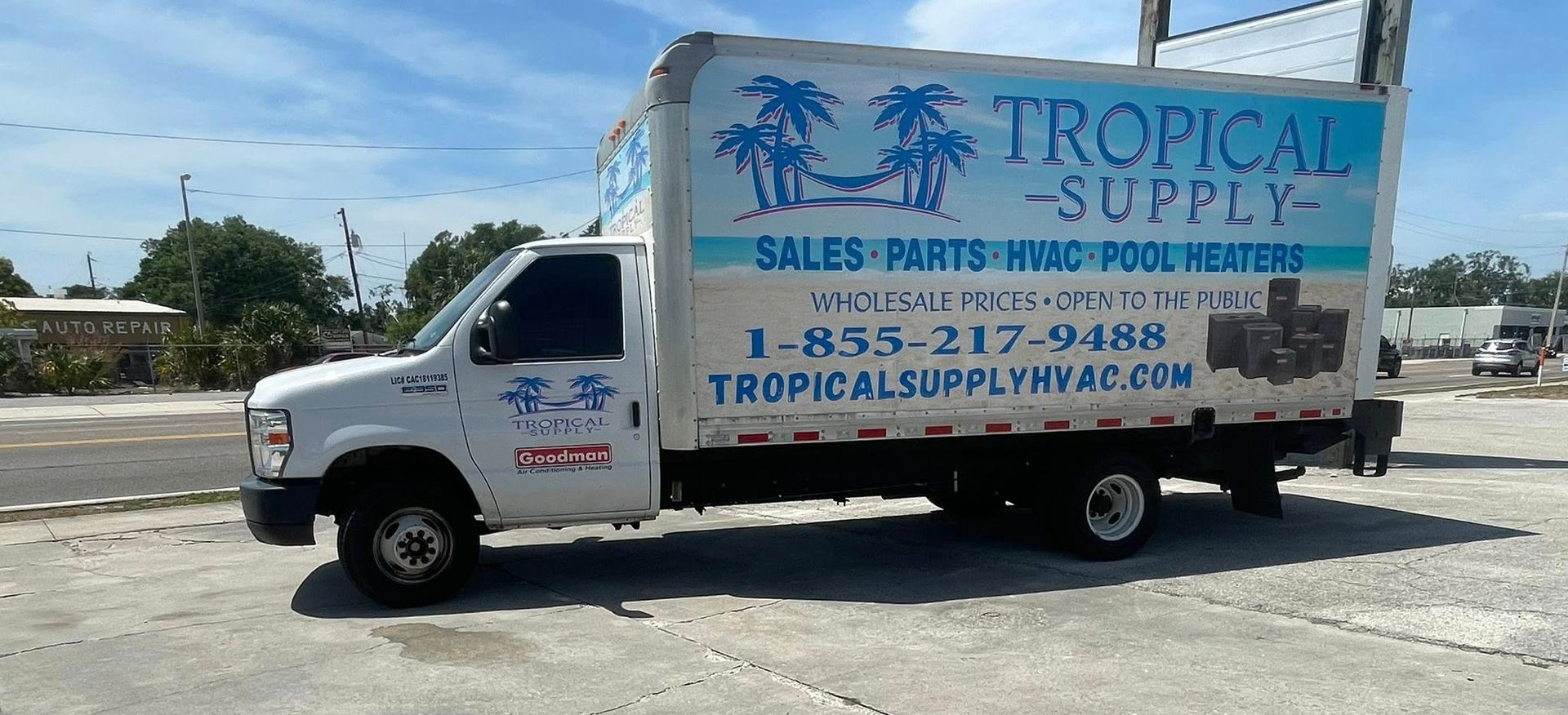 White box truck with Tropical Supply logo parked on a concrete surface.
