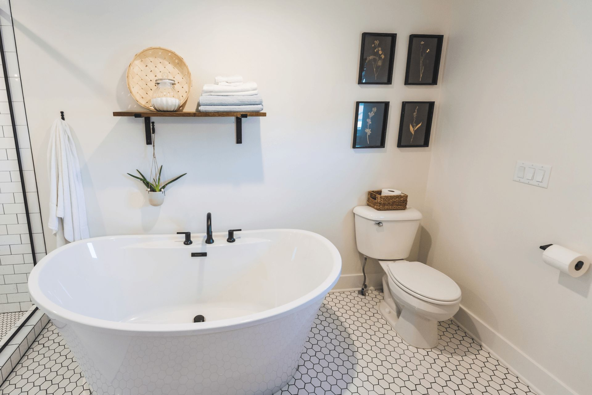 There is a bathtub and toilet in the bathroom.