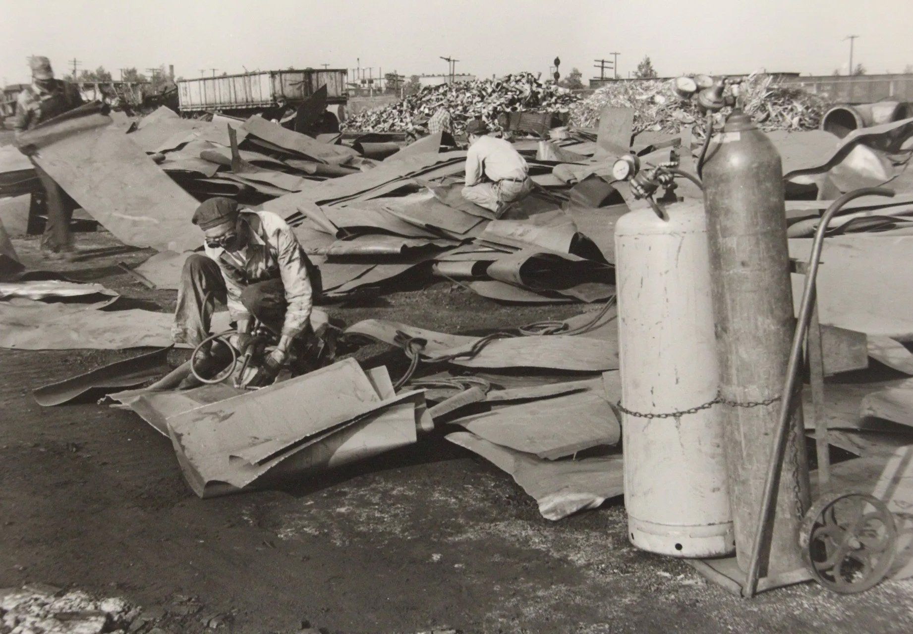 Old photo of men working on a scrap metals