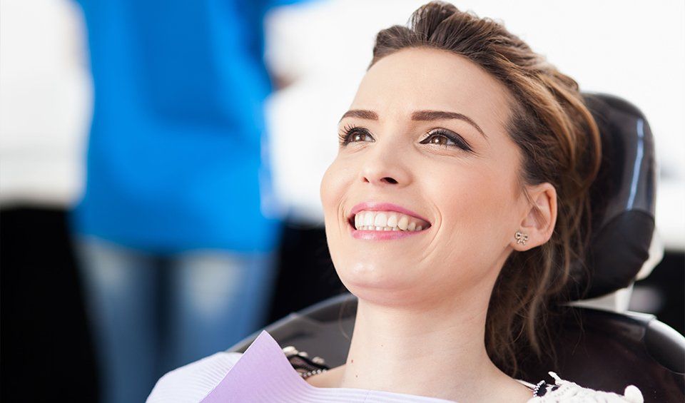 Happy woman in dental clinic