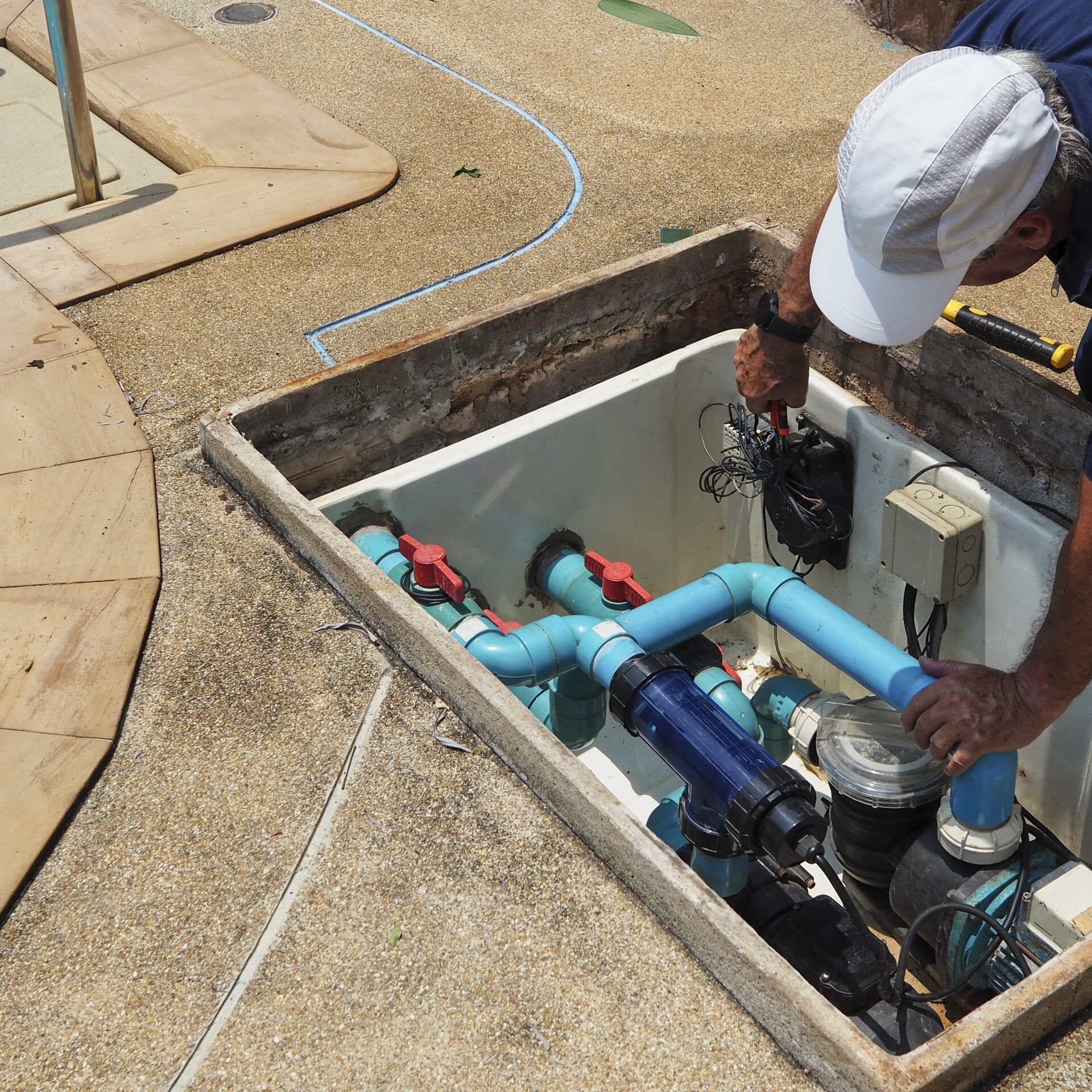 A team member installing some energy-efficient equipment.
