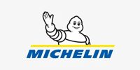 Michelin Man mascot with smiling face and raised arm