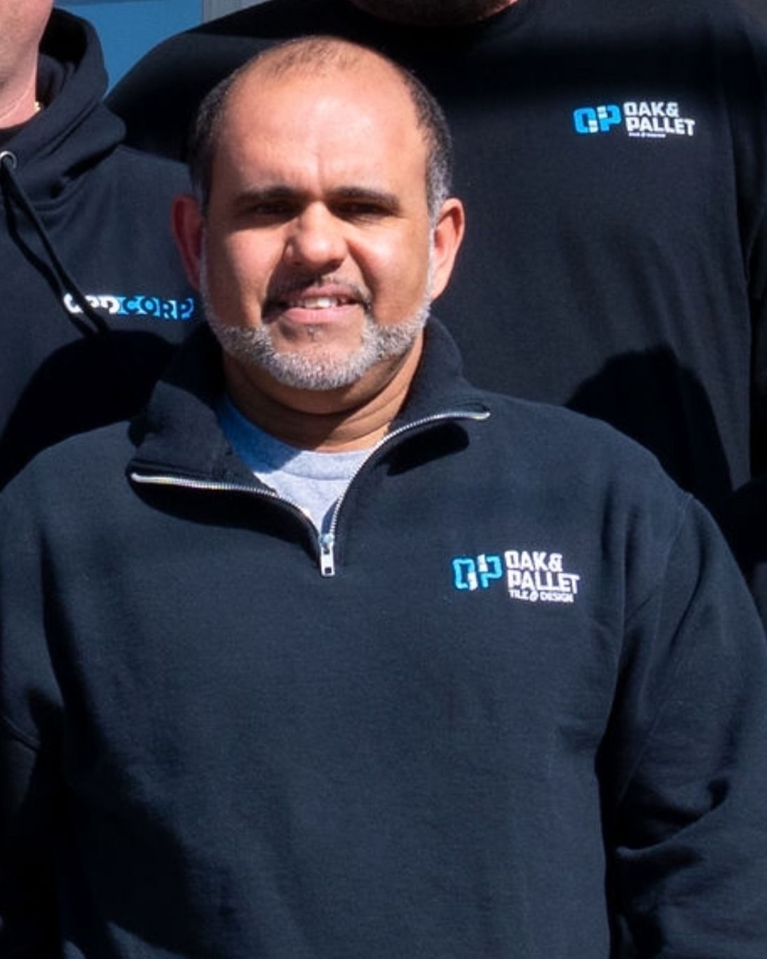 Man in black sweatshirt with 