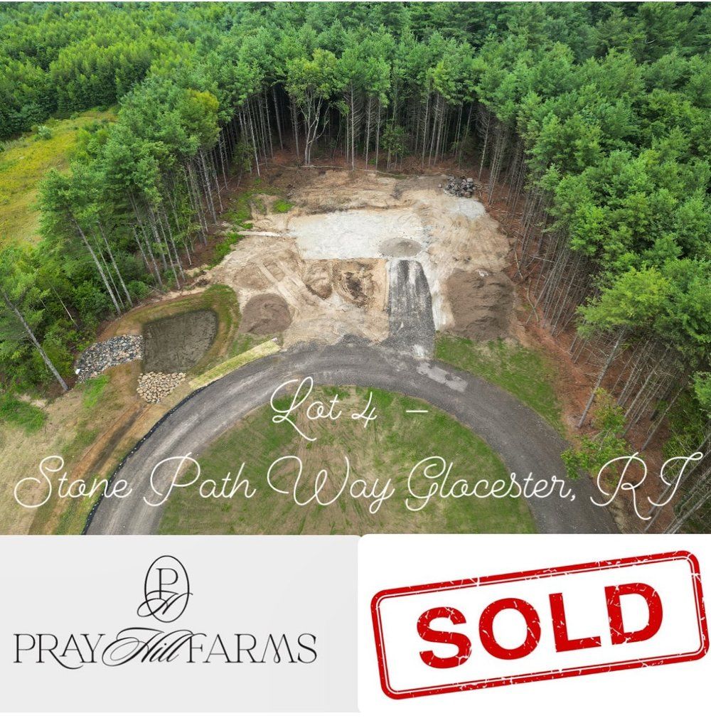 Aerial view of cleared lot in Gloucester, RI with driveway, 