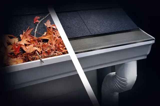 Gutter with leaves and debris being cleared beside a black shingled roof and downspout