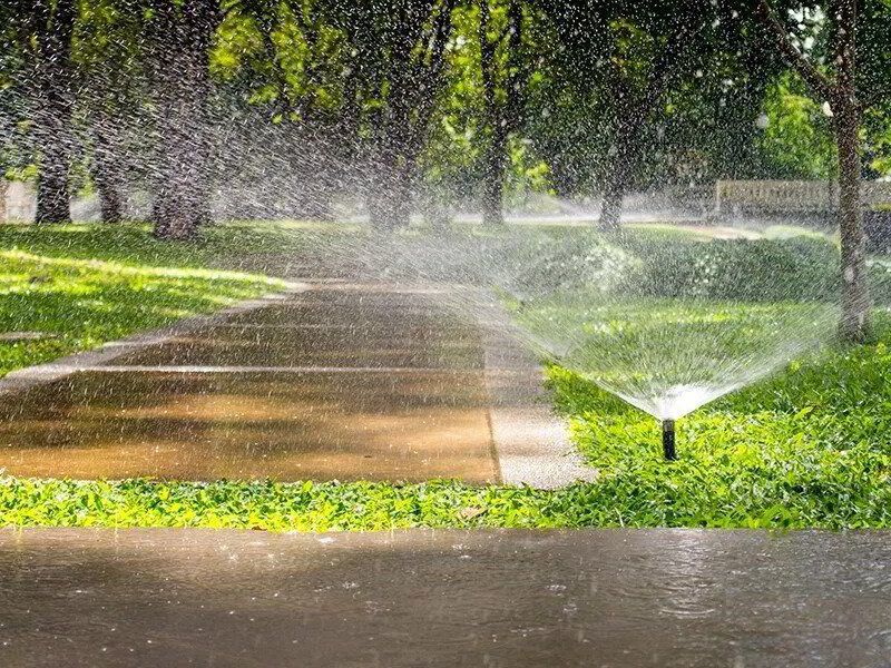 Walkway with sprinkler