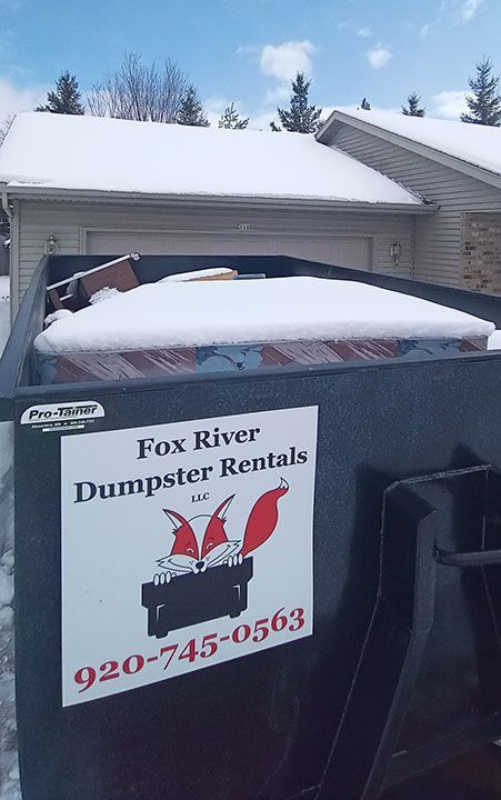 a dumpster with a sign on it