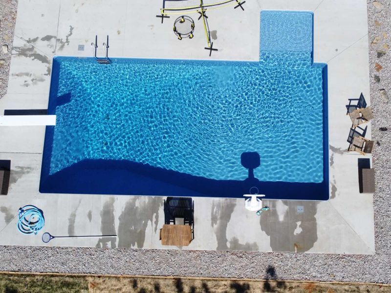 An aerial view of a swimming pool under construction