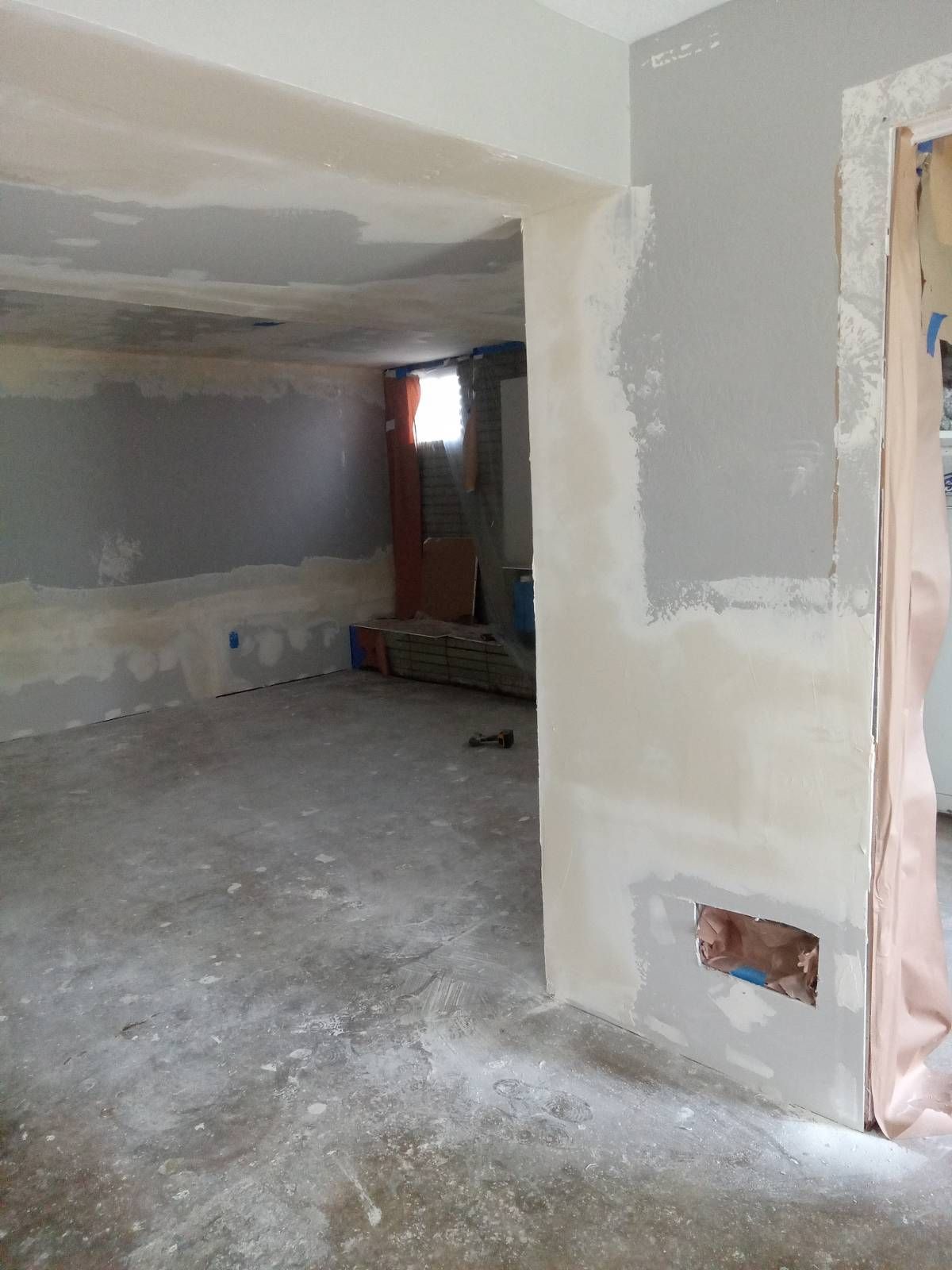 There is a hole in the wall in the middle of the room.