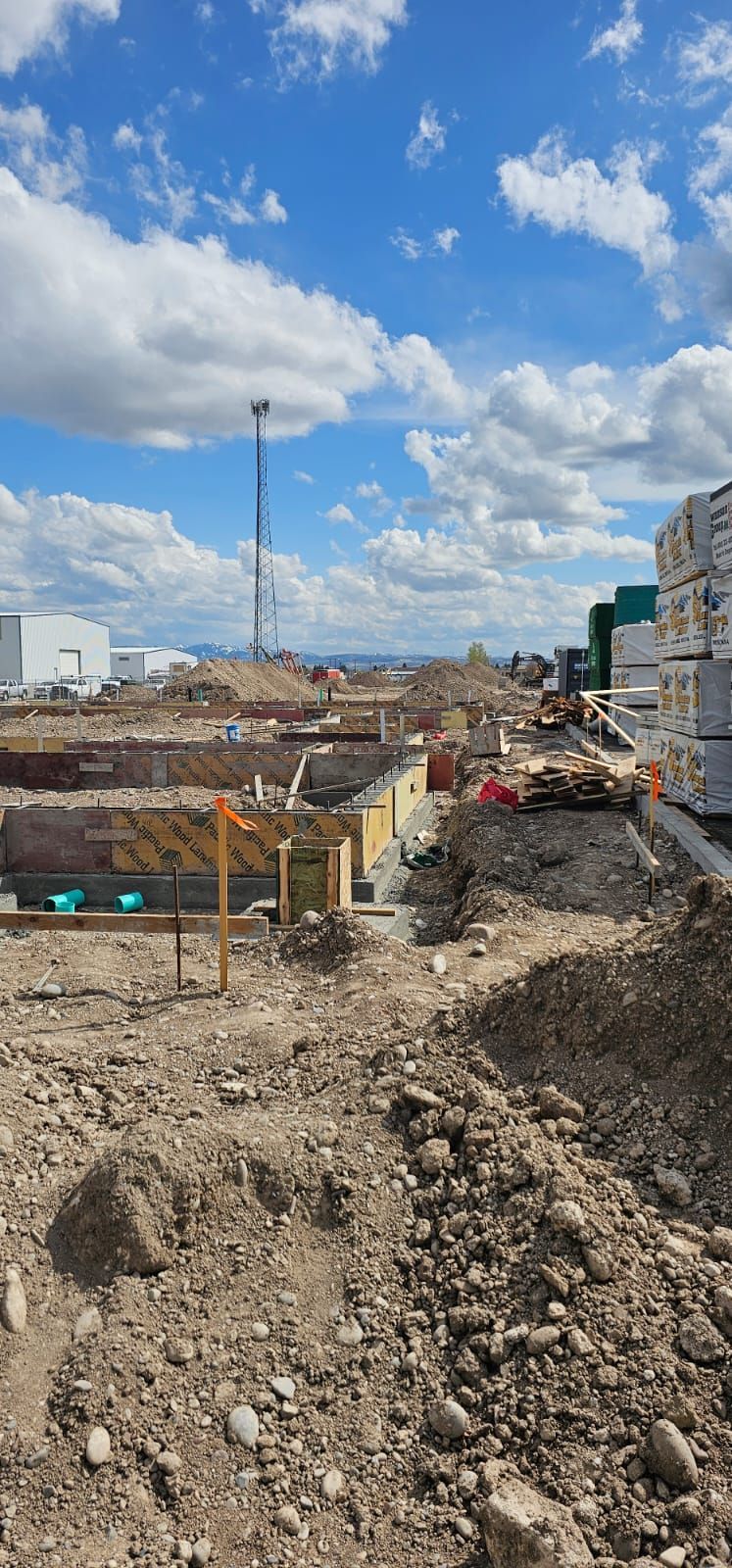 A construction site with a lot of dirt and rocks.