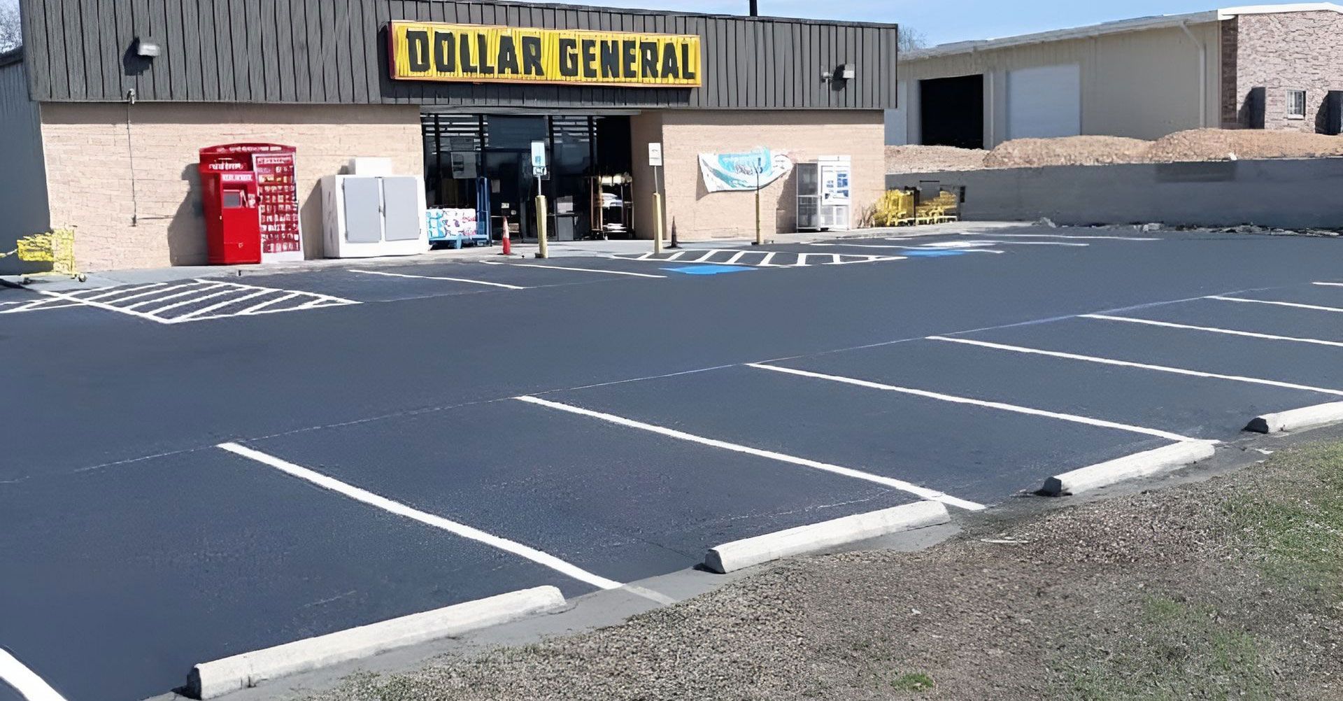 Dollar General store exterior with empty parking spaces.