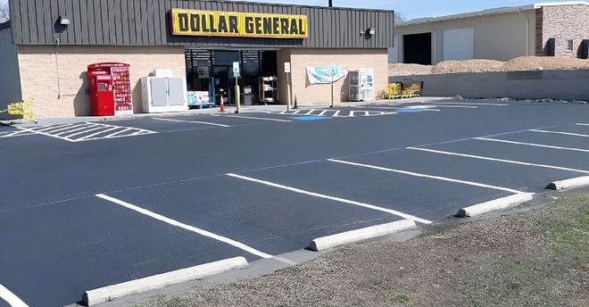 Dollar General store exterior with empty parking spaces.