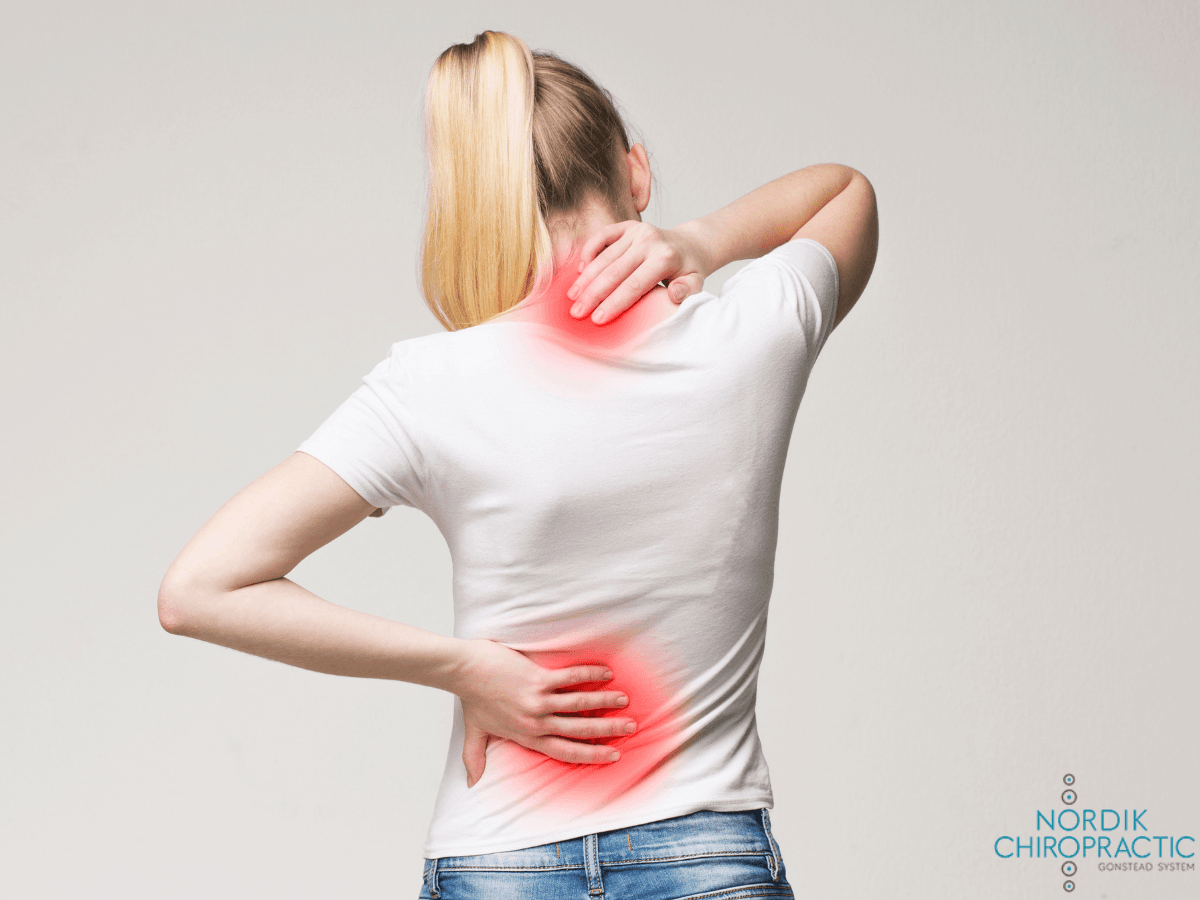 Person holding neck and lower back with red pain highlights on a white background