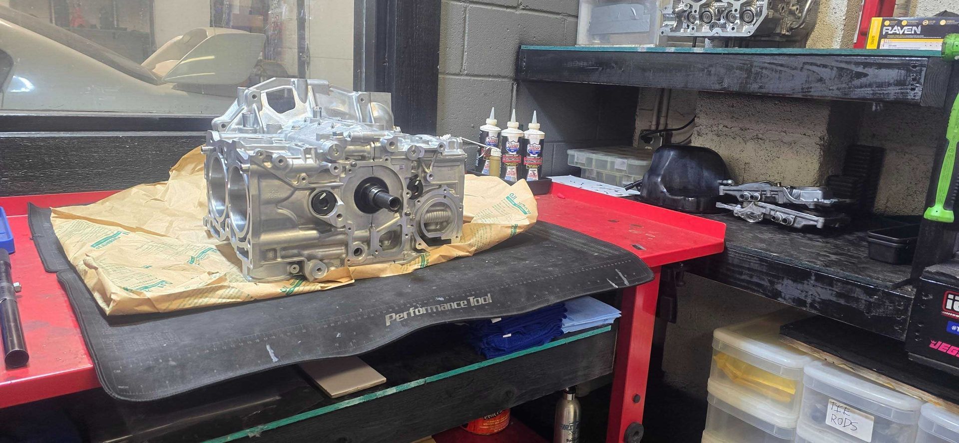 Engine block on a workbench. Mechanical workshop setting.