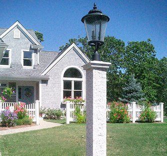 A house with a lamp post in front of it
