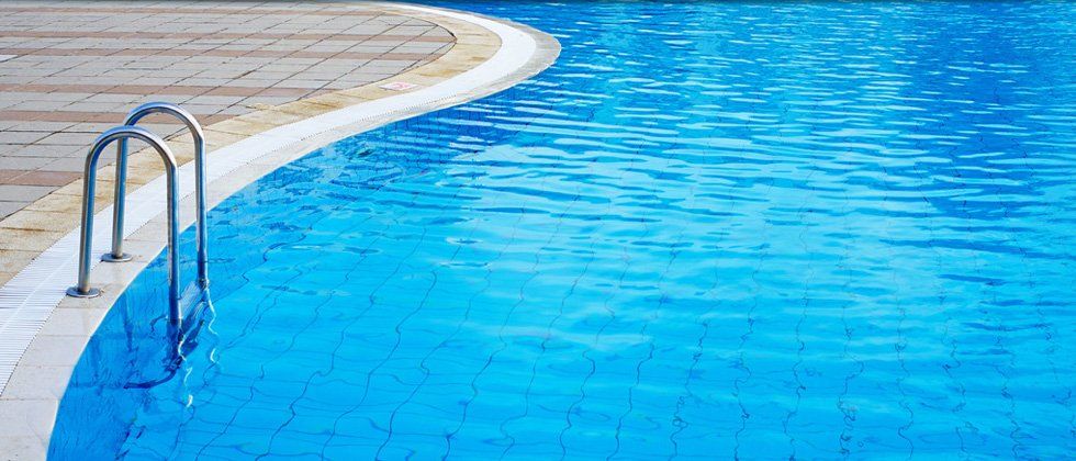 Metal ladder in swimming pool