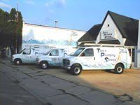 Three white vans with 