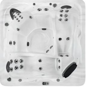 Overhead view of a white, multi-person hot tub with various jets and seating areas.