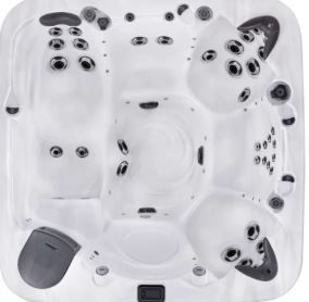Top-down view of a white, multi-person hot tub with various jets and seating areas.
