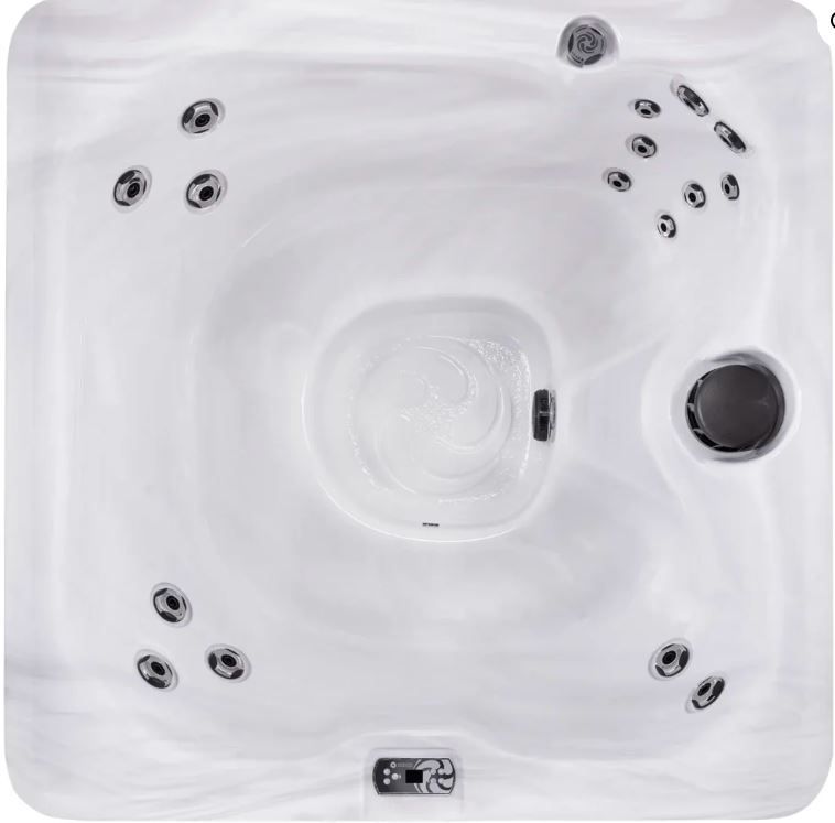 Overhead view of a white, square hot tub with multiple jets.