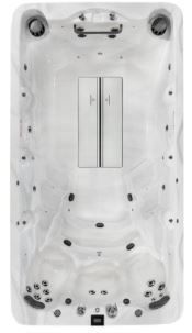 Top-down view of a rectangular hot tub with multiple jets and central cover. White and gray speckled interior.