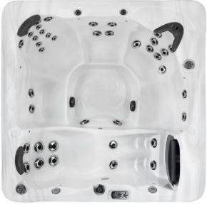 Overhead view of a white hot tub with multiple jets, seating areas, and a filter, set outdoors.