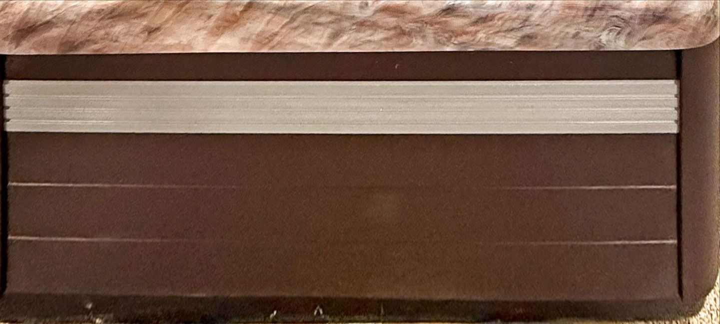 Brown cabinet with a horizontal silver trim.