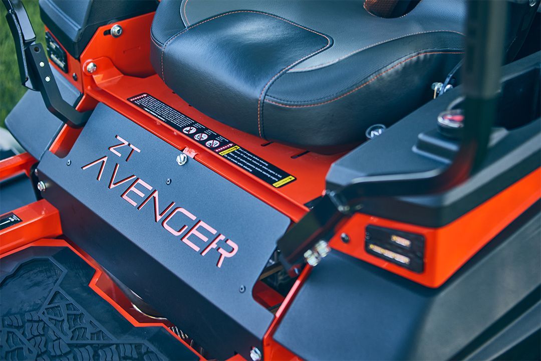 Orange and black ZT Avenger zero-turn lawnmower seat and control panel.