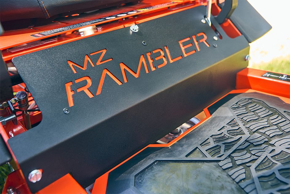 Black and orange lawnmower part with 