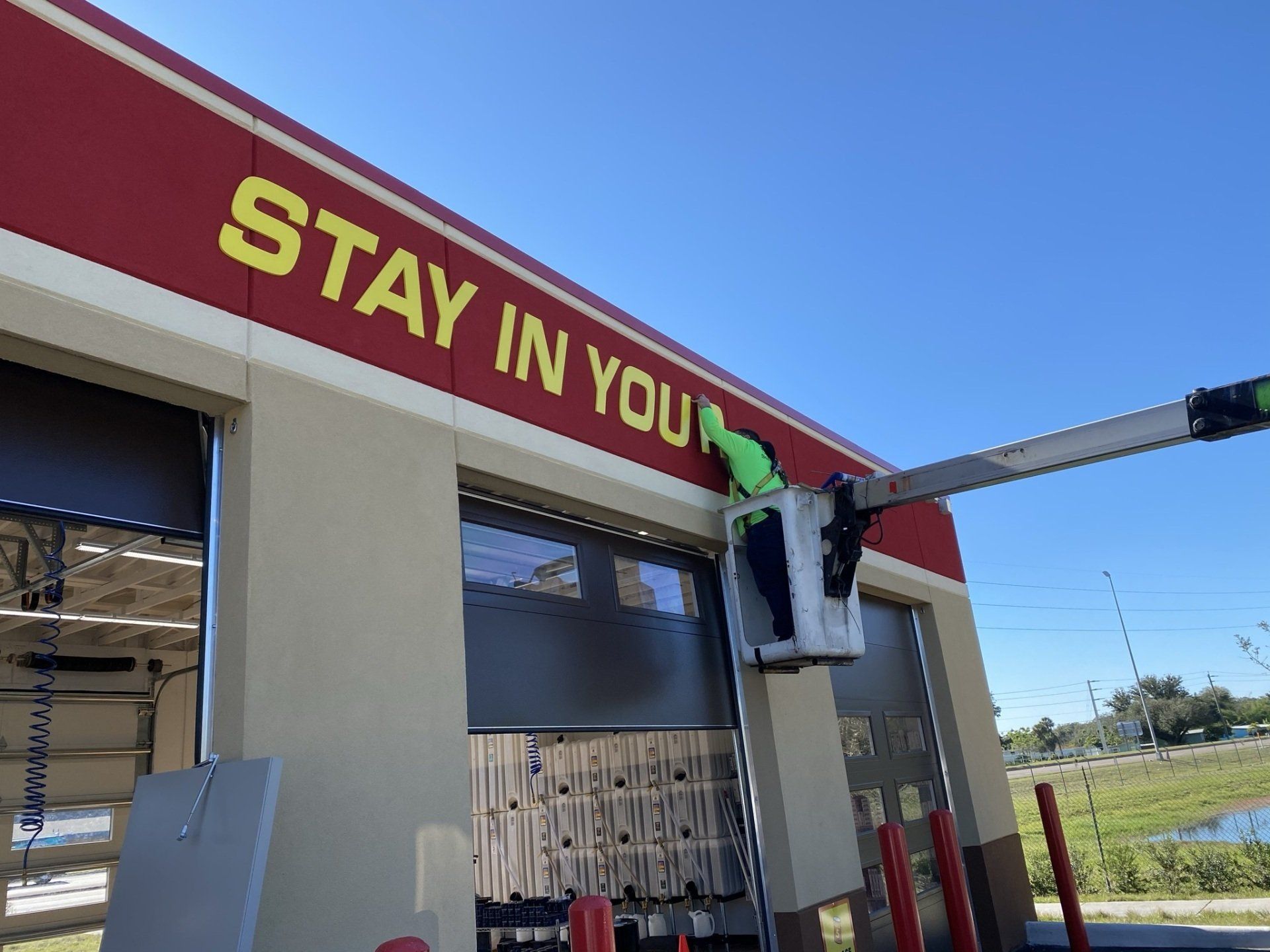 Man installing signage