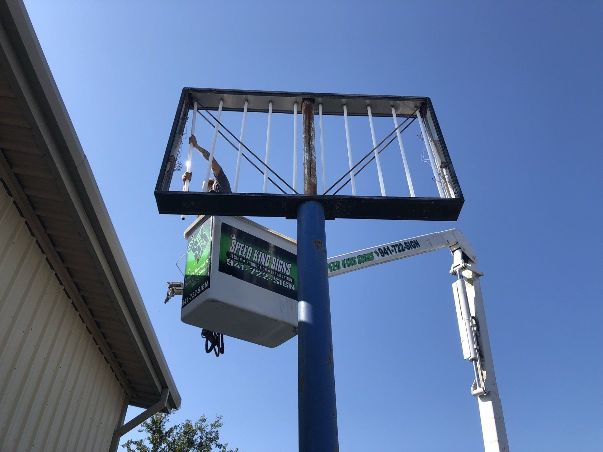 Man installing signage
