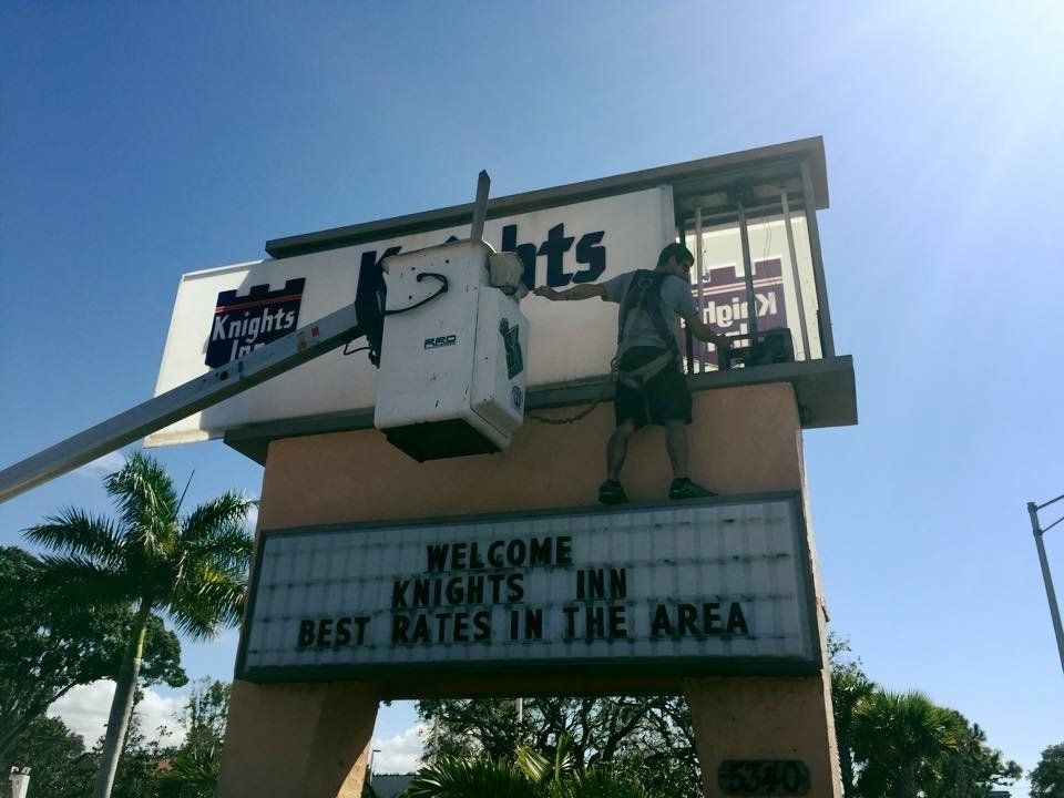 Man installing signage