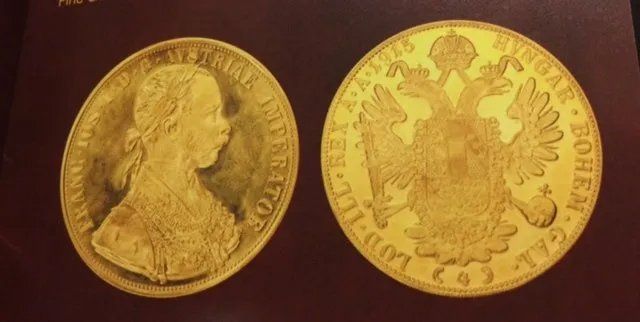 Two gold coins, one with a profile of a woman, the other with a double-headed eagle emblem.