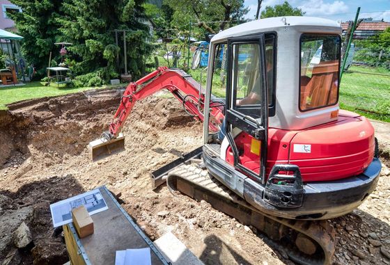 Excavator digging soil