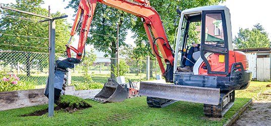 Excavator digging soil
