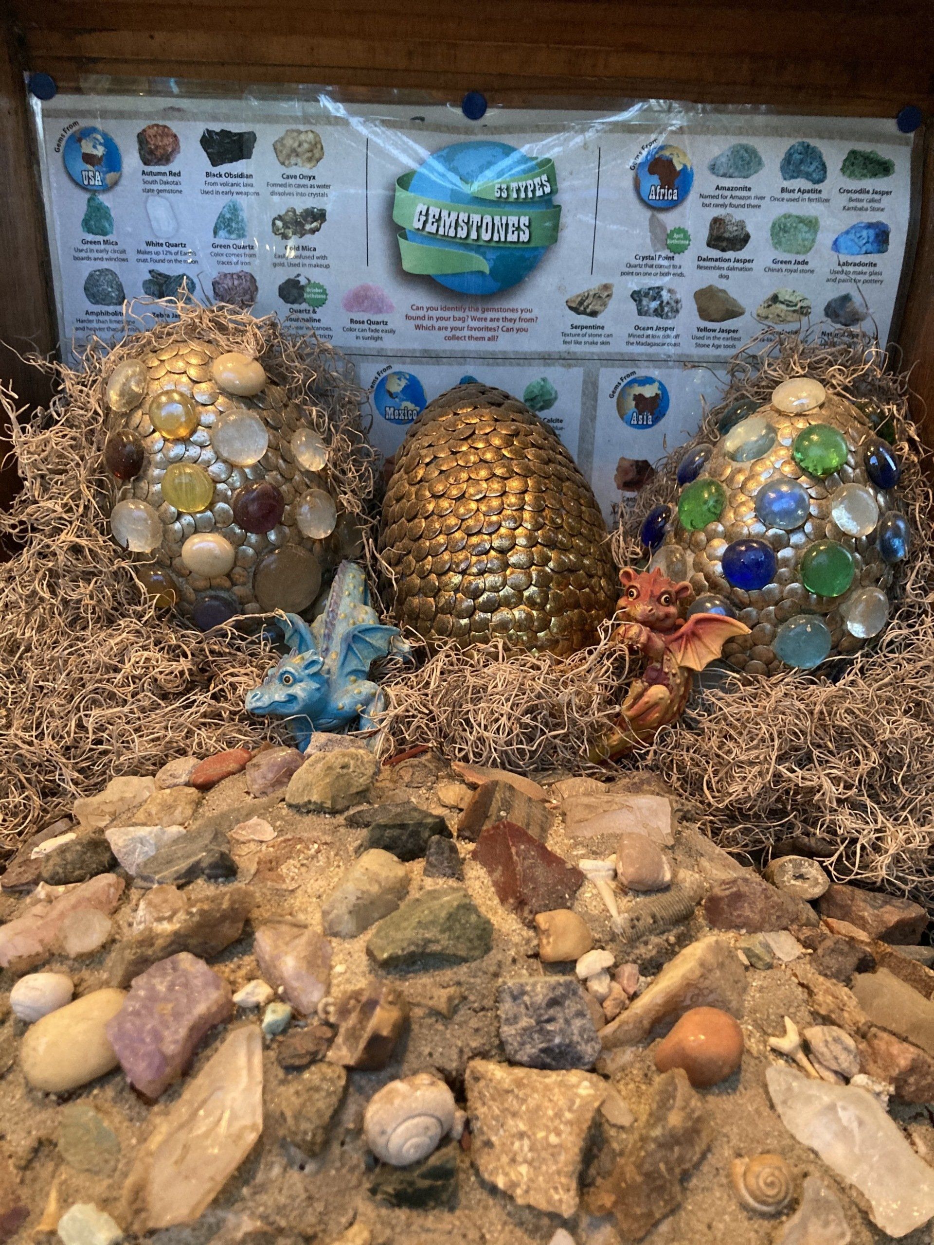 A treasure chest filled with rocks and eggs.