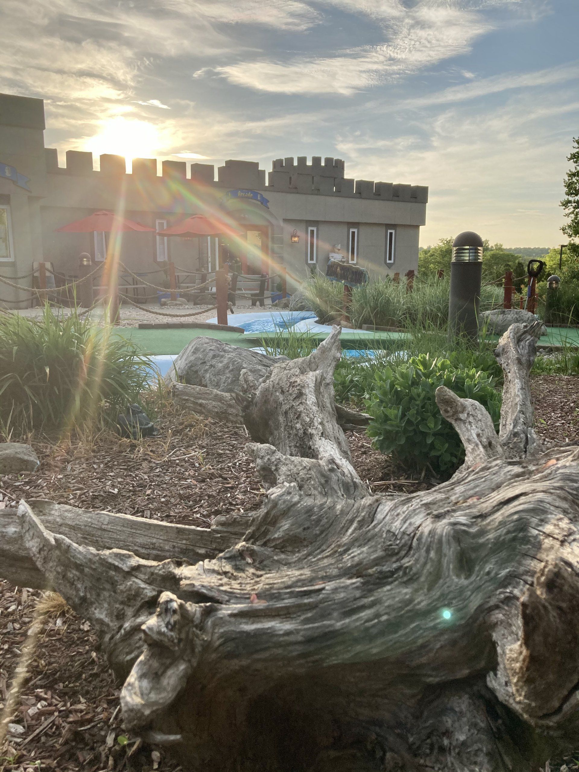 sun is shining on the mini golf area