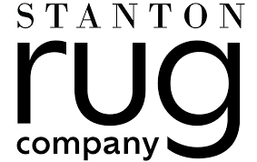 A black and white logo for stanton rug company